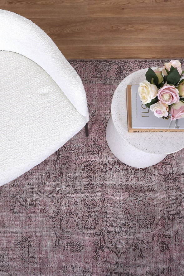 Elevate the style of any room with the Germain Rose Rug. With its stunning medallion design and distressed look, this area rug adds a touch of elegance to your decor. And with its stain and water-resistant properties, spills are no match for this durable and easy-to-clean rug.