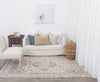 Agora Ornate Beige Wool Rug in living room with furnishings on clonde flooring