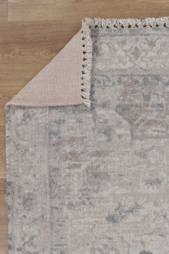 Agora Ornate Beige Wool Rug folded corner photo