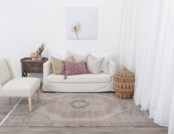 Agora Bazaar Terracotta Wool Rug in living room with furnishings on blonde floor