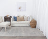 Agora Souk Ivory Wool Rug in living room with furnishings on blonde flooring