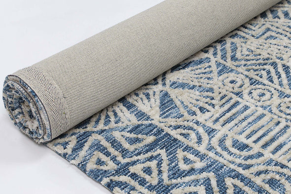 Alayah blue Flower Rug rolled with light cotton backing