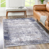 Grey and blue abstract rug with subtle distressed border, made from recycled cotton. Stain and water-resistant.