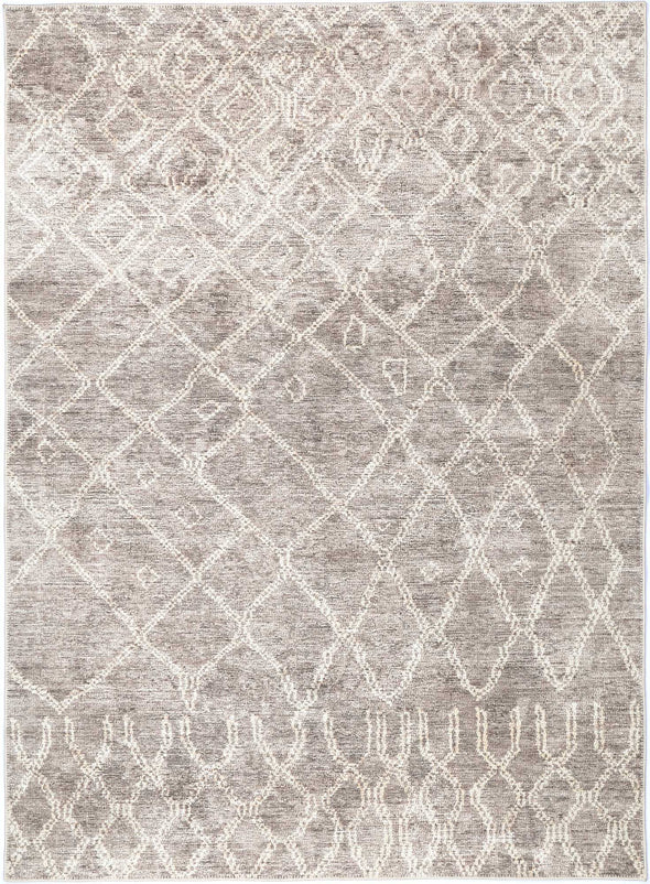A beige, gold, and taupe rug with a warm and sophisticated aesthetic, made from recycled cotton and designed for indoor use.