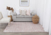 Allure Cotton Rayon pink Rug on wooden flooring with cream chair, taupe sofa and wicker accessories