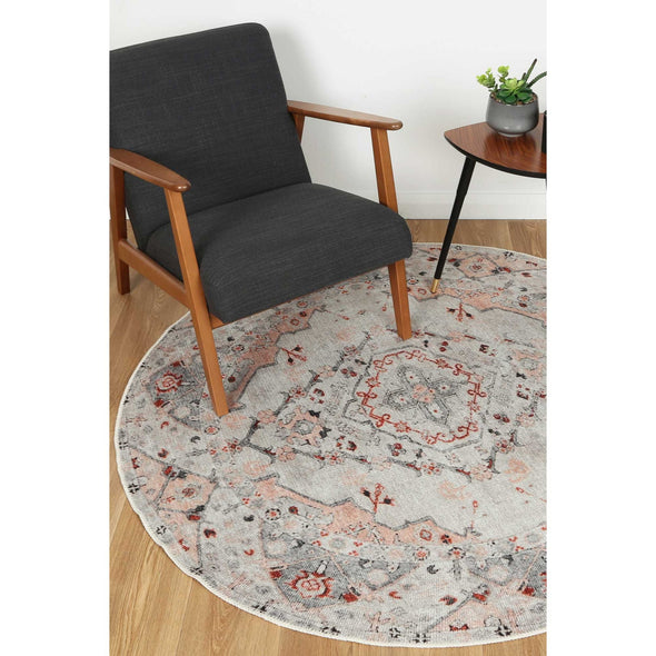 Image of the durable and stylish Sauville Rug from the Vintage Crown collection placed under a chair, highlighting its practicality with features like NanoWipe technology and machine washability.